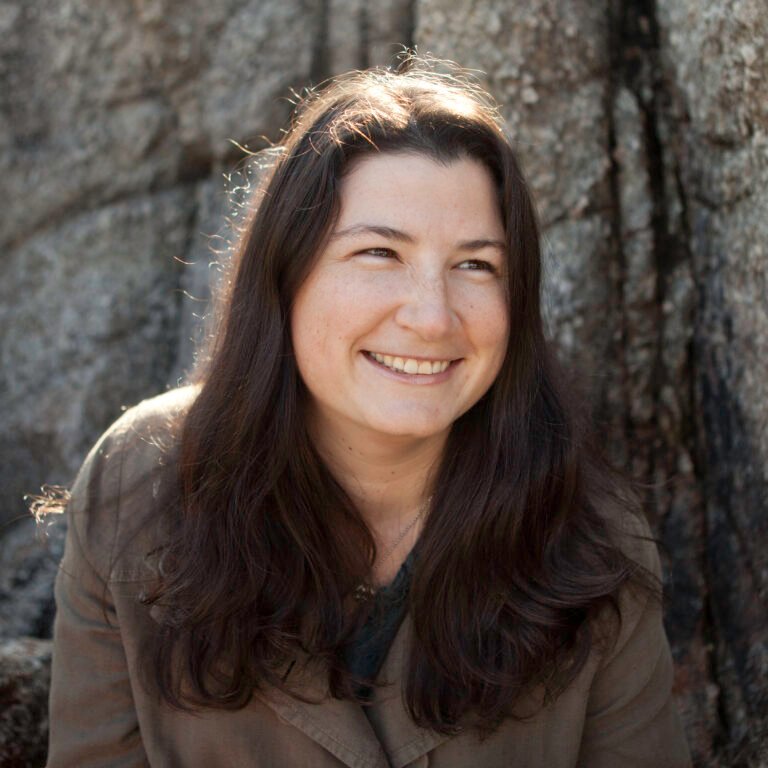 Image of Jessica Riehl. Jessica is a white woman with long brown hair.